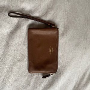Cute little coach wristlet! Brown has a couple scuffs will be able to clean up.
